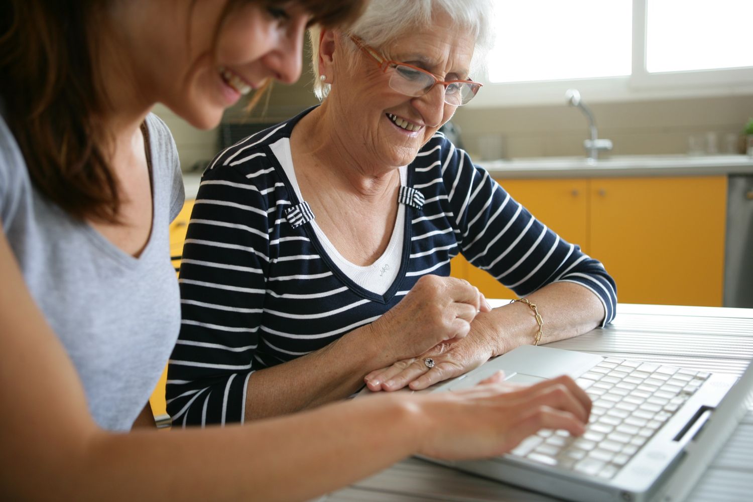 SGS Economics and Planning Young and Older working on laptop